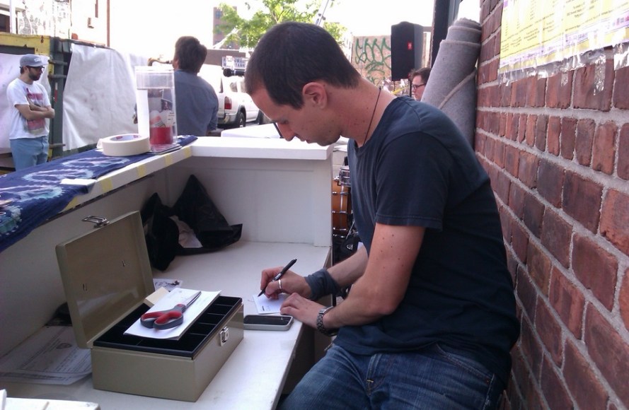 Avi writing out his song list for his set