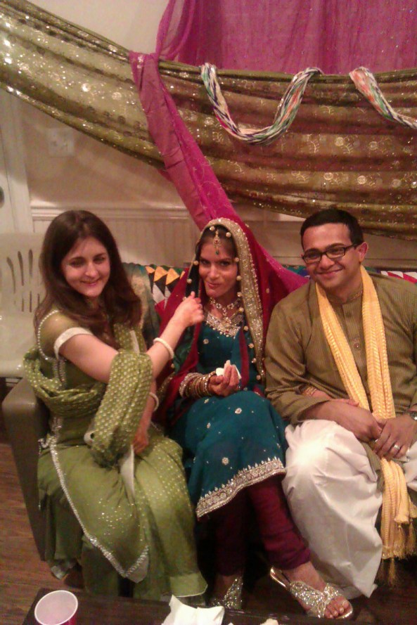 Me feeding the happy bride and groom at the Mehndi. Special thanks to Sarah for the beautiful shalwar kameez!