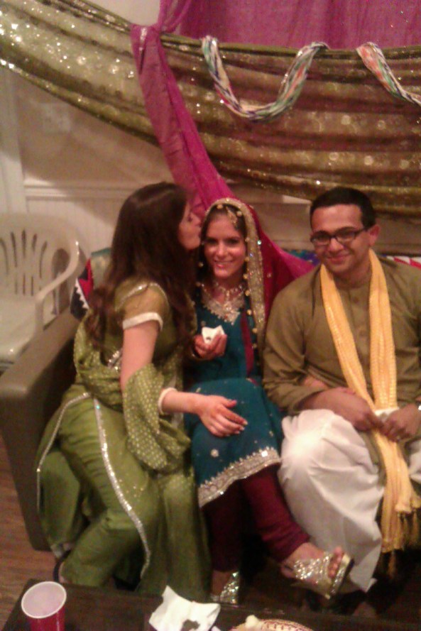 Me kissing the happy bride, Christina. To the far right, Hasan.