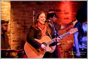 Casey Dinkin singing at the Leave A Lasting Mark Concert Series Van Morrison Tribute Show, on 2/9/2012 at The Bitter End in NYC. Photo by Manish Gosalia, courtesy of www.caseydinkin.com