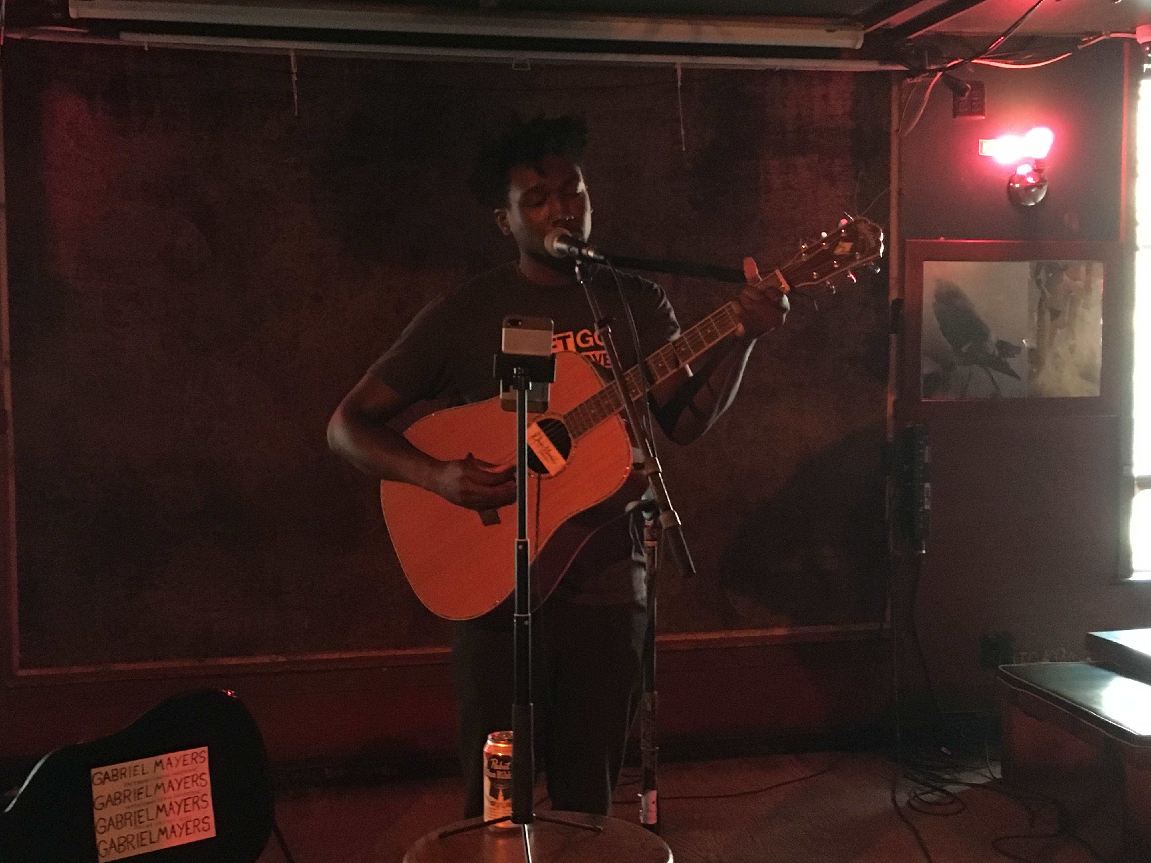 Gabriel Mayers performs on acoustic guitar at Pianos, Oct. 2017