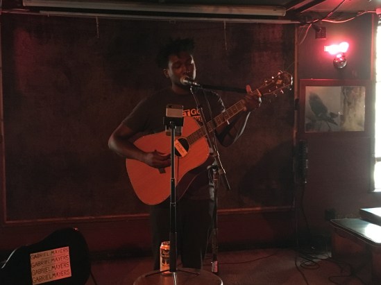 Gabriel Mayers performs on acoustic guitar at Pianos, Oct. 2017