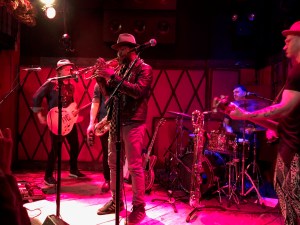 Maurice Brown (trumpet player) onstage with Jamie McLean, his band, and Steve Salcedo (behind Maurice)